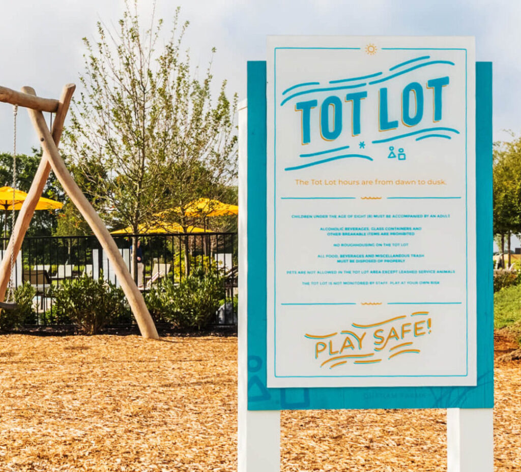 Wayfinding signage for master planned community featuring Tot Lot sign designed by ST8MNT